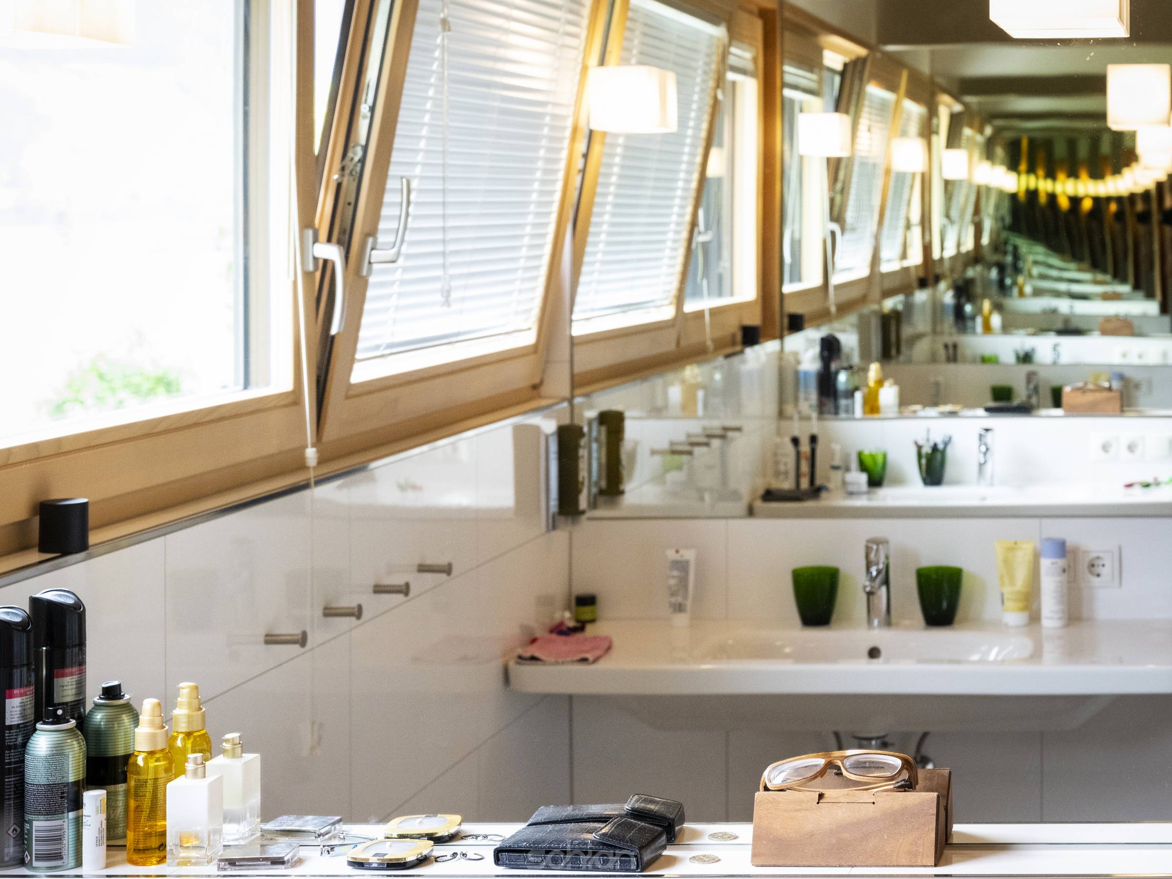 infinite endless mirroring bathroom with sink window and lamps