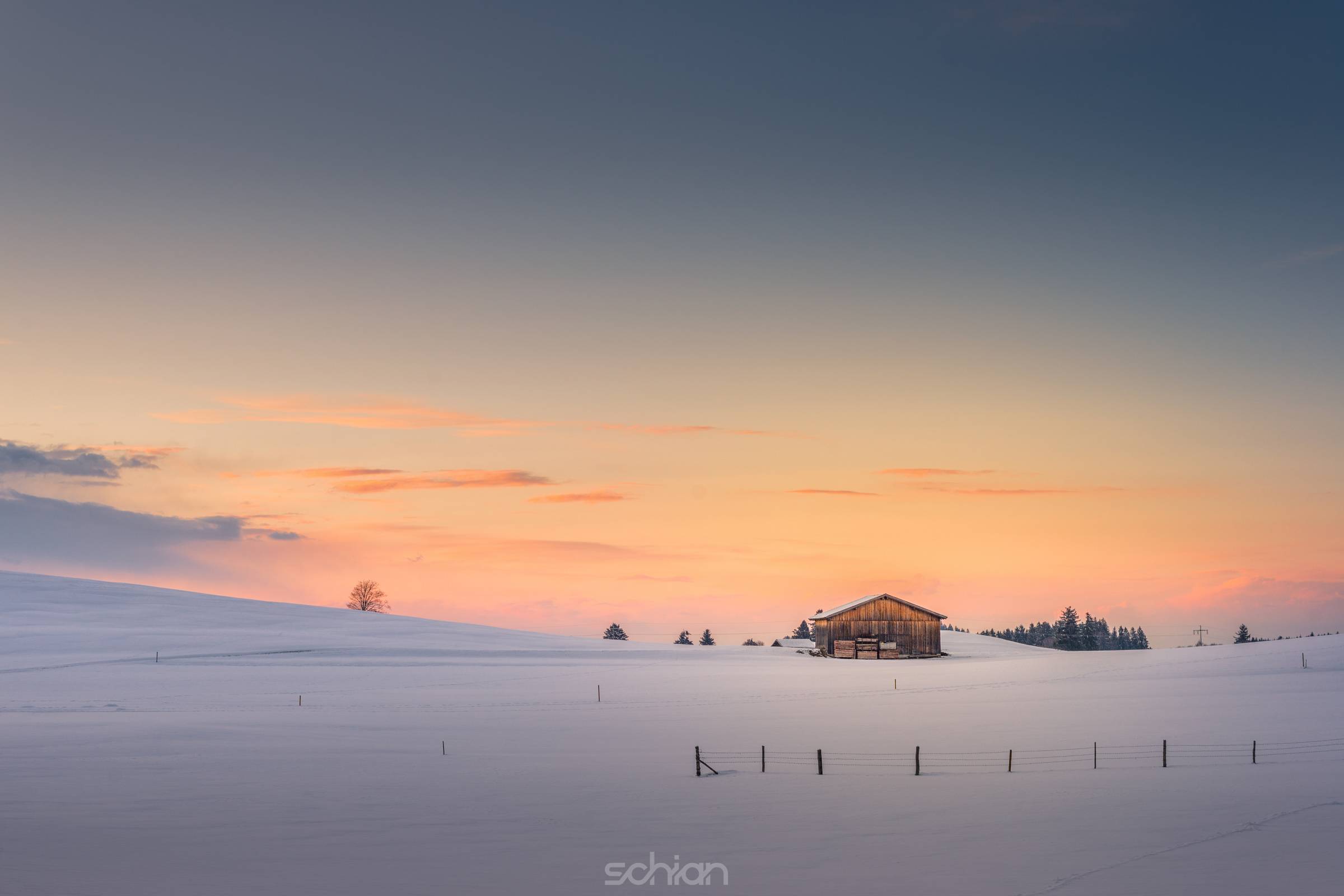 single hut at afterglow sunset sky in winter