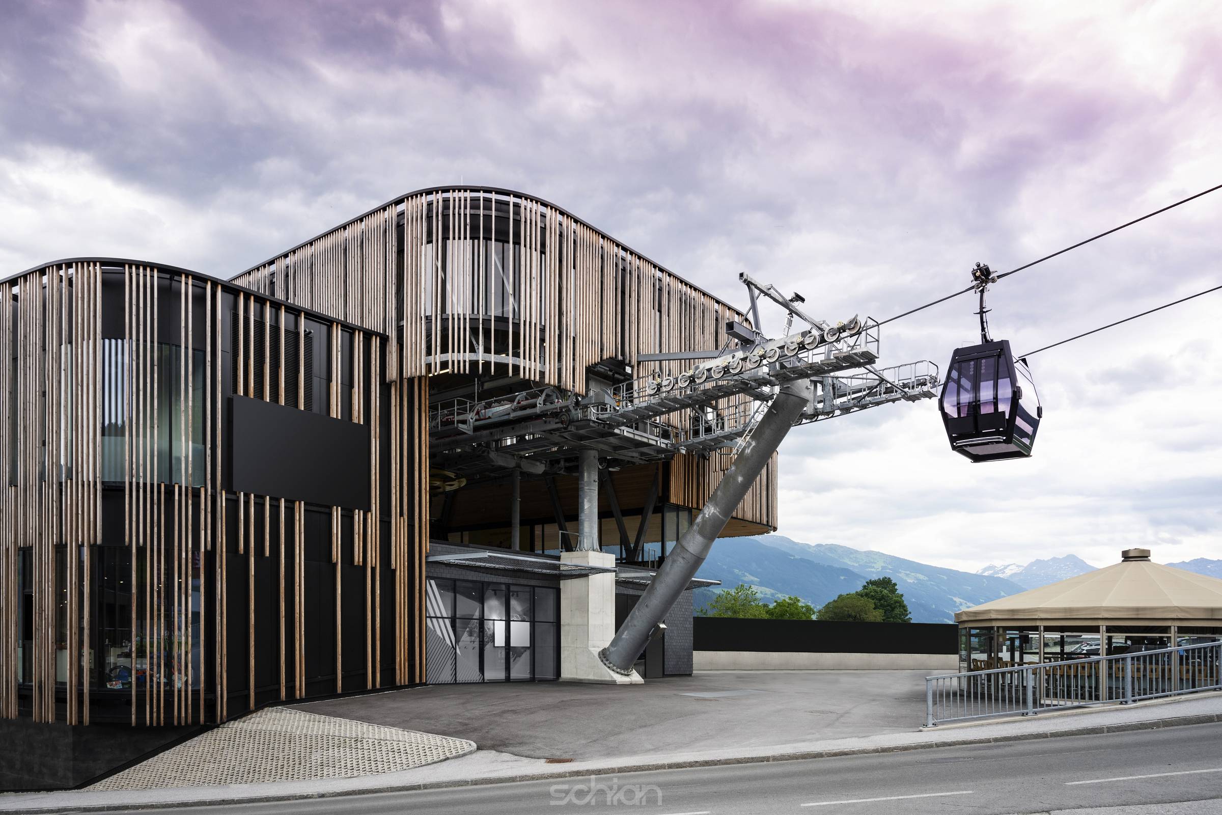 valley station of modern ropeway with gondola with cloudy sky in tirol mountains