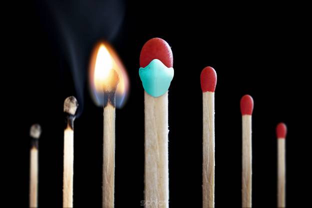 protection with breathing mask on lucifer match against corona covid-19 infection 