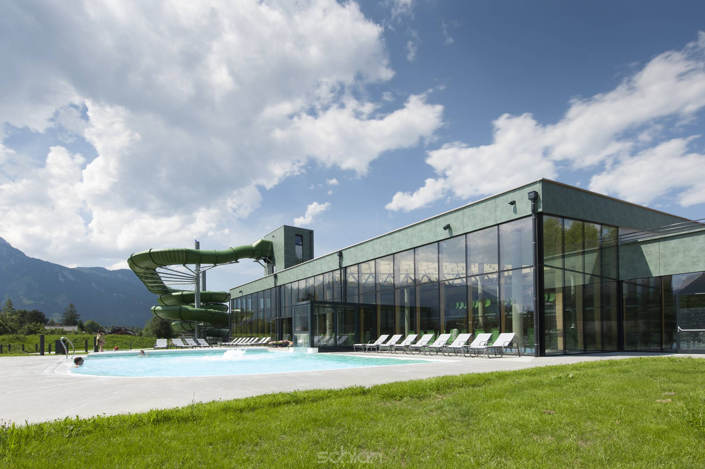 swim bath with outdoor pool and water slide at summer day